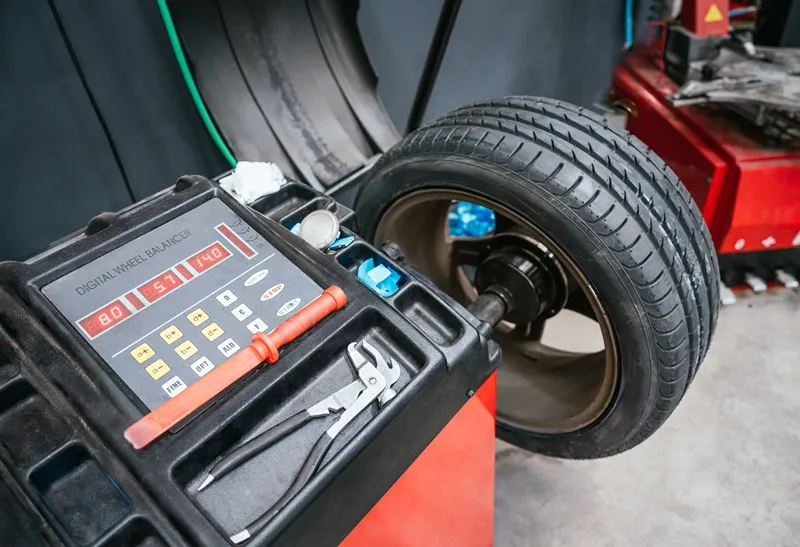Wheel alignment machine in an automotive workshop